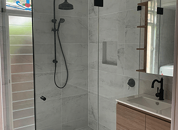 Shower With Marble Tiles — Builders in Maitland, NSW