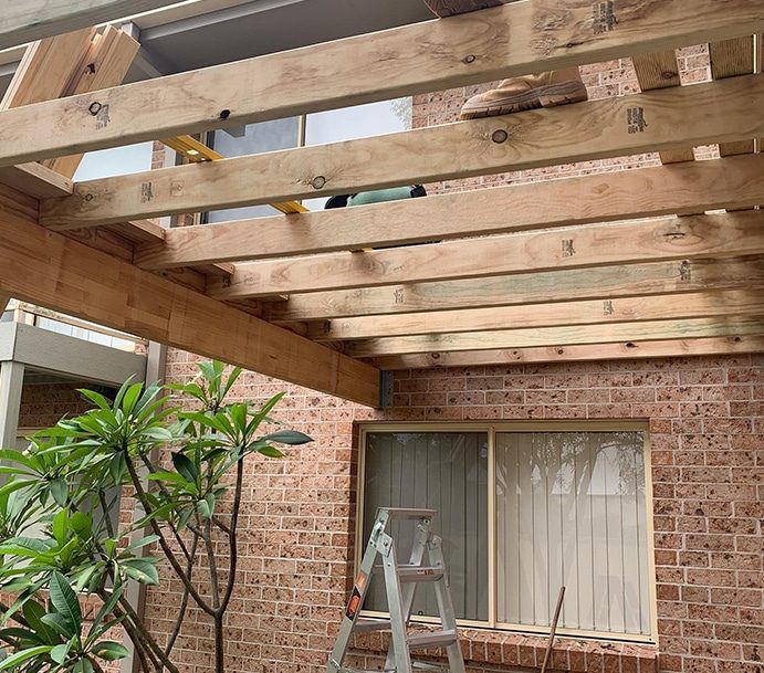 Construction Workers Building Patio Roof — Builders in Hunter Valley, NSW